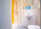 Thumbnail 1 of 8 - a small bathroom with a toilet sink and shower