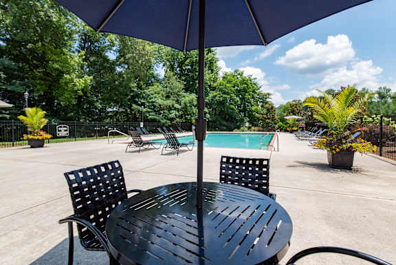 A large swimming pool with the word RELAX in the foreground.