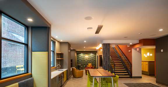 A modern kitchen with a dining table and chairs at The Gallery Apartment Homes Apartments, Allentown, PA, 18101