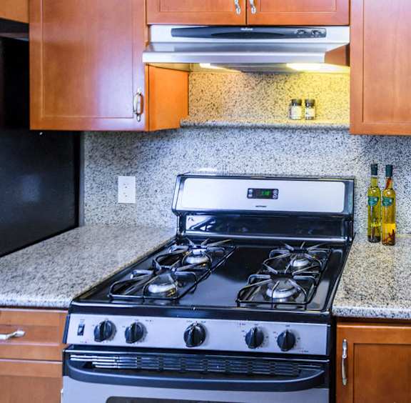 A black stove top oven with a digital display in the middle.