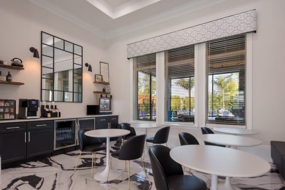 a room filled with furniture and a large window