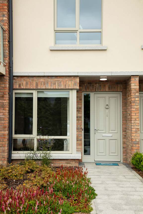 the front of a house with a white door