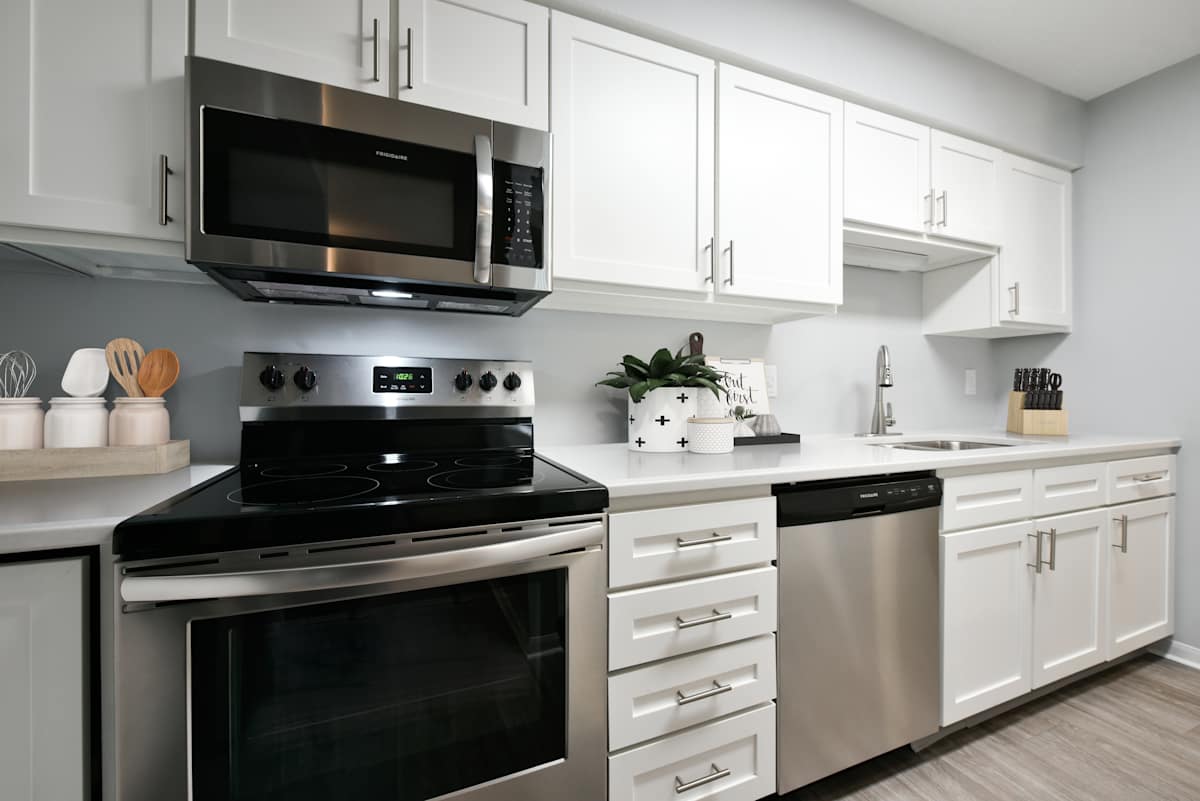 The Donovan Apartment Homes kitchen with white shaker cabinets - Lincoln, NE