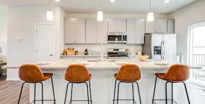 Kitchen with Brown Bar Stools at Refinery Row in Baltimore, Maryland