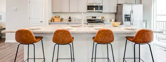 Kitchen with Brown Bar Stools at Refinery Row in Baltimore, MD 21224