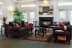 clubhouse with couches a coffee table and a fireplace