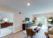 Thumbnail 4 of 33 - a living room with couches and chairs and a table at Edgebrook Residences, Merrimack, NH