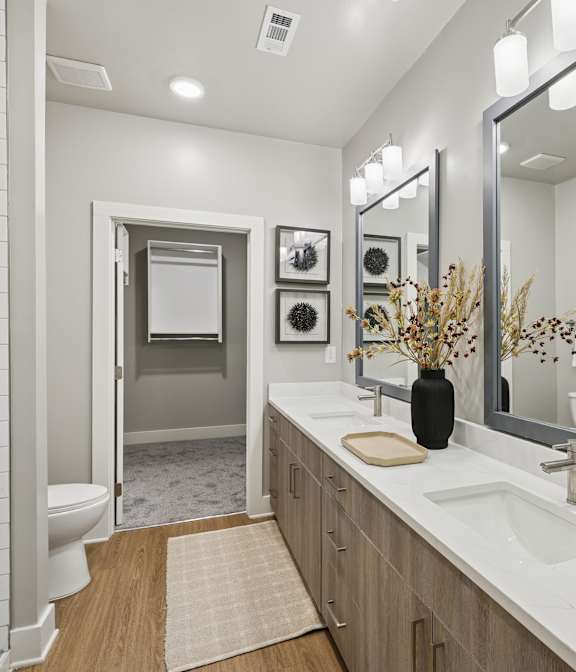 A bathroom with a white sink and a mirror above it at The Beacon at 331 Apartments, Santa Rosa Beach, Florida