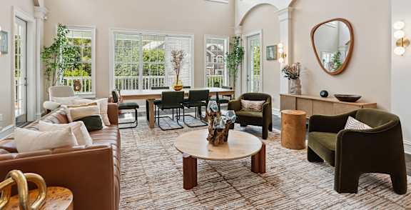 a large living room with couches and a table