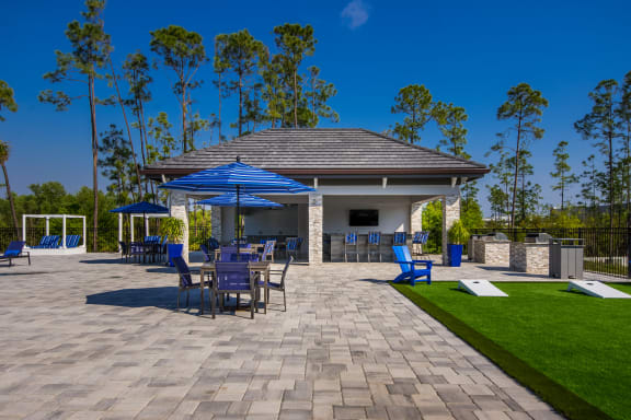 a large pavilion with a seating area and a bar