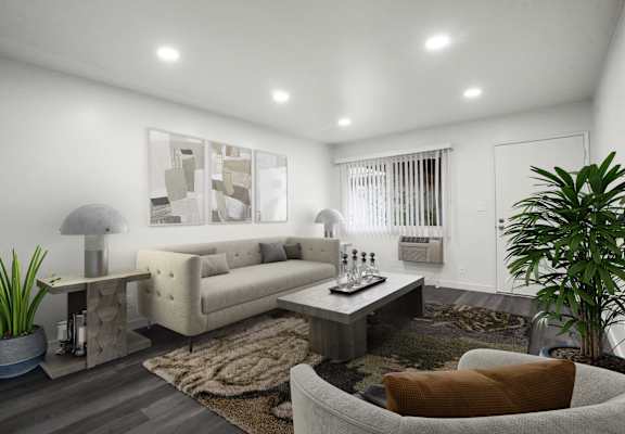 A modern living room with a white sofa, a grey armchair, a coffee table, and a rug.