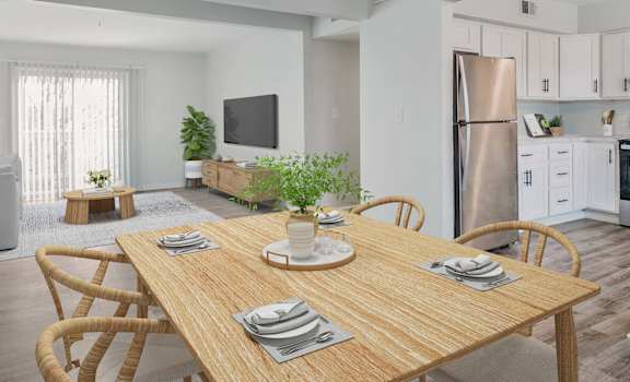 A dining table set with plates and a potted plant on top.