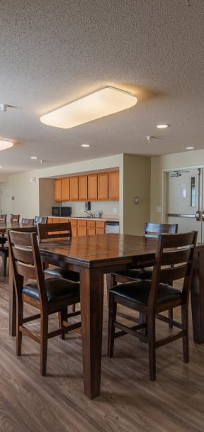 a large dining room with a large table and chairs