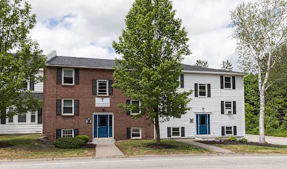 a picture of an apartment building on a street