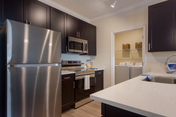 Gourmet Kitchen With Island at The Oasis at Manatee River, Bradenton, FL