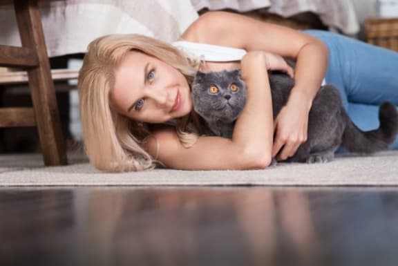 Women holding Cat at The Benjamin Seaport Residences, Boston, MA, 02210