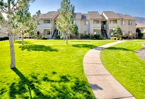 A row of houses with a pathway in front of them. at Sharlands Terrace Apartments, Apartments, Reno, NV