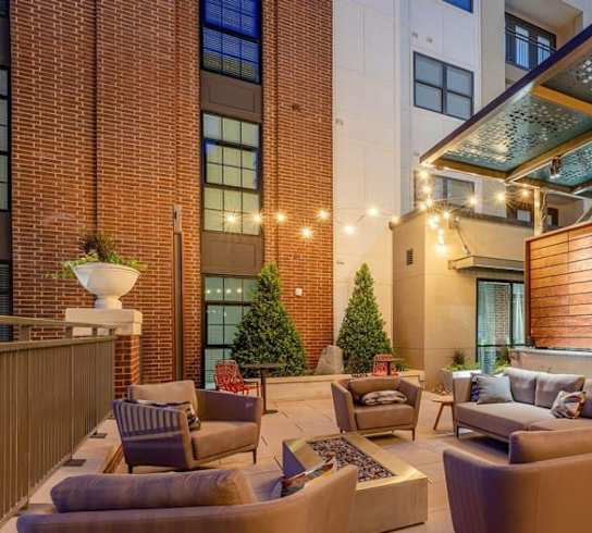 A patio area with a fire hydrant on the side.