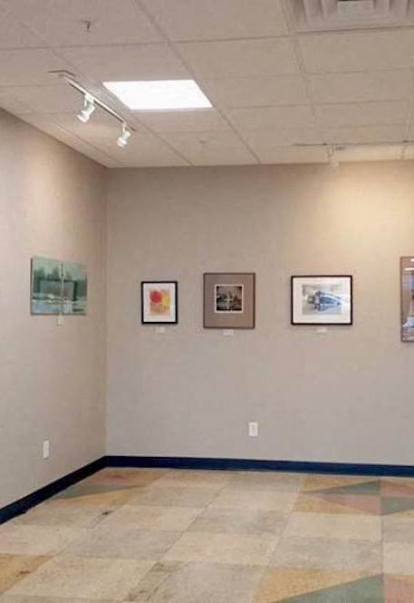 artwork on walls for community show at Hoffman Hotel Apartments