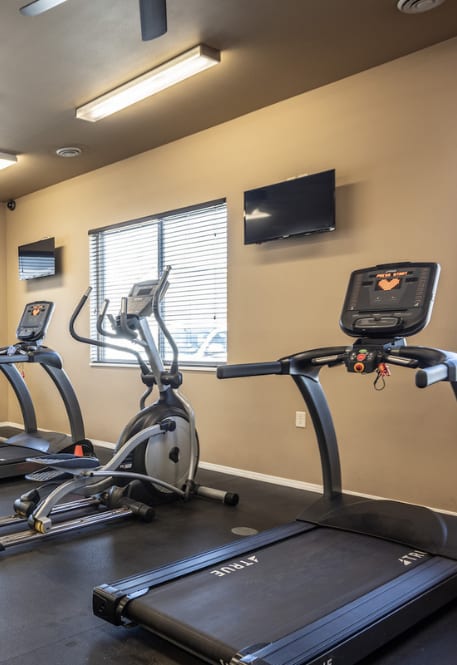 the fitness room at the village apartments