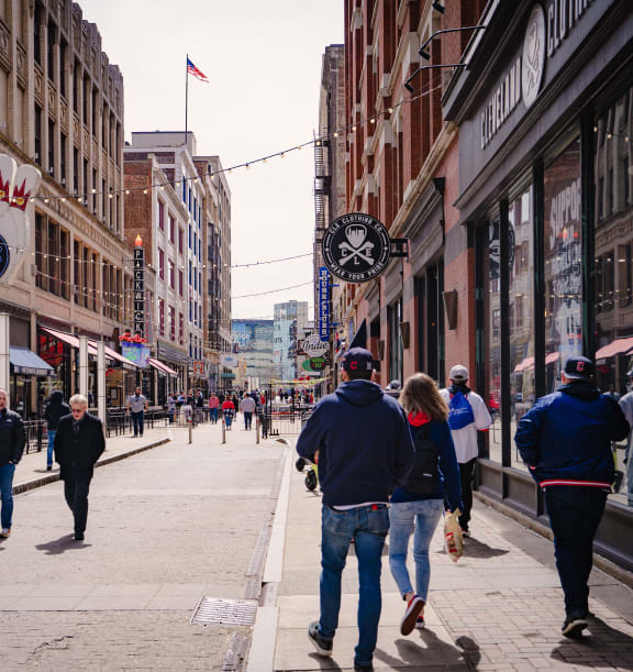 people walking down a busy street in the city