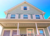 Thumbnail 4 of 11 - Exterior of property with front porch
