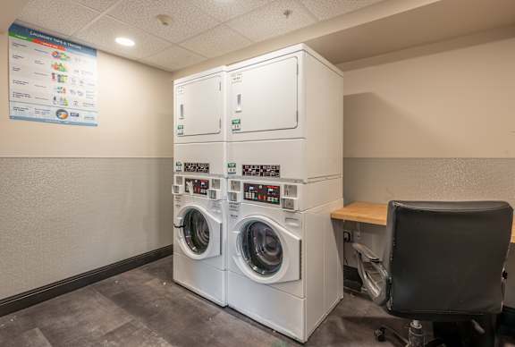 A washing machine repair shop with a sign on the wall.