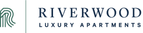 the logo for riverwood luxury apartments in the dark