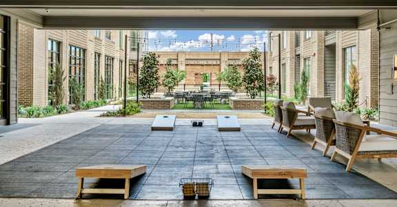 A patio with a table and chairs is shown.