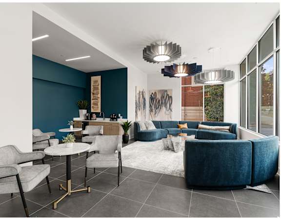 A modern living room with a dining table and grey chairs.