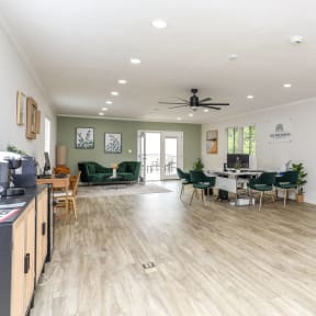 a living room with a table and chairs and a dining room