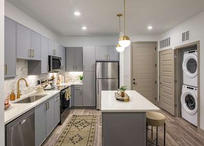 Kitchen in brass marble design at Wayfern Apartments in Sandy Springs GA