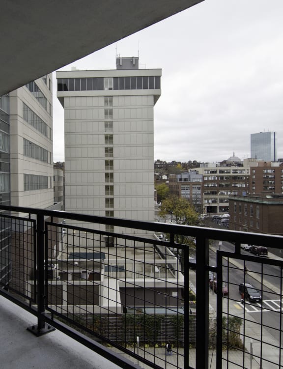 a balcony with a view of the city