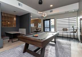 Pool table in a game room at Vibe Apartments at Arbour Lake, Calgary, T3G 4J2