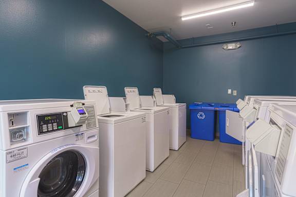laundry room with washing machines and dryer at AVIA Lofts on Victors Way, Ann Arbor, 48108