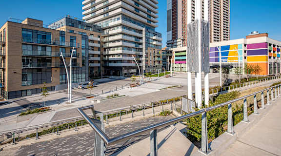 A modern cityscape with a mix of residential and commercial buildings.