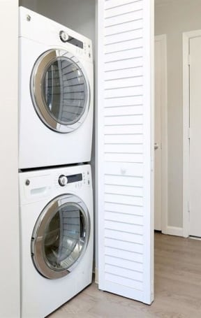 a washer and dryer in a room next to a closet at The Pier at Sausalito, Sausalito