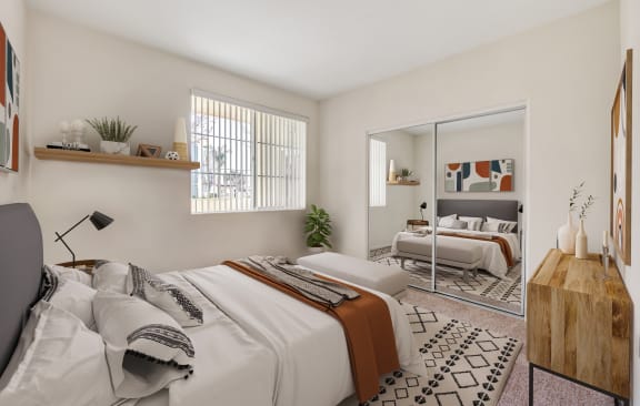 a bedroom with two beds and a large mirror