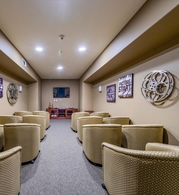 room filled with chairs and seating in a room with a couch
