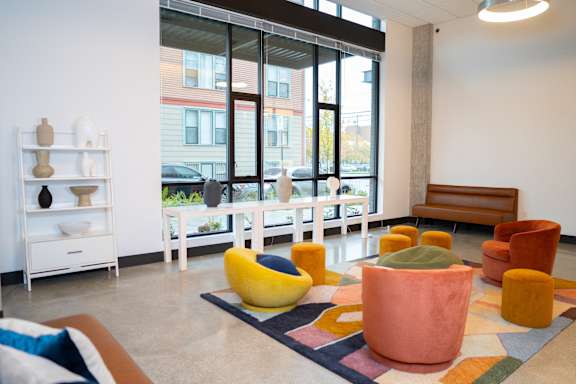 a living room filled with furniture and a large window