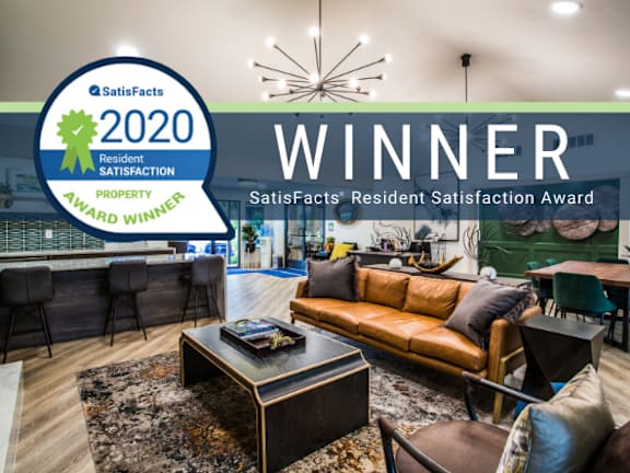 a living room with a couch and a coffee table    and a winner