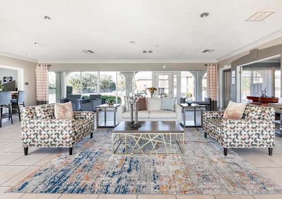 A living room with a patterned sofa and a coffee table.