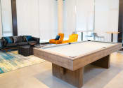 Thumbnail 23 of 23 - a pool table in a room with couches and chairs