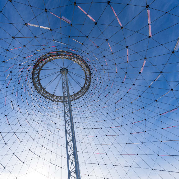a ferris wheel with a blue sky in the background
