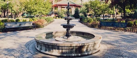 a fountain in the middle of a park at The Enclave, Jersey City, New Jersey
