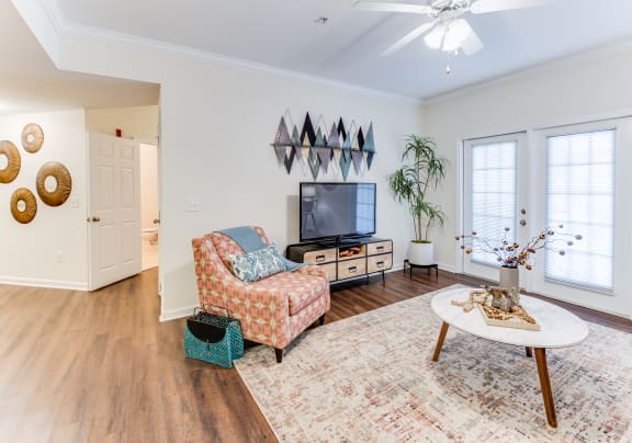 a living room with a tv and a coffee table