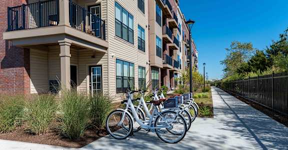 A bicycle is parked on a sidewalk in front of a building.