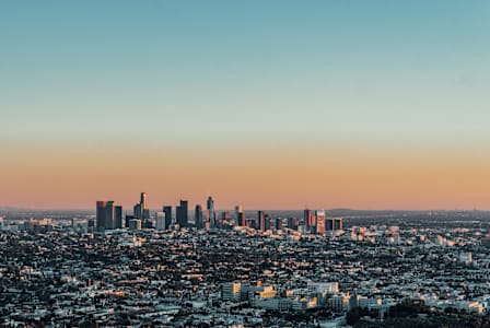 A cityscape with buildings and a clear sky.