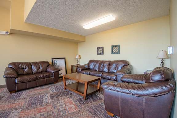 a living room with couches and a coffee table