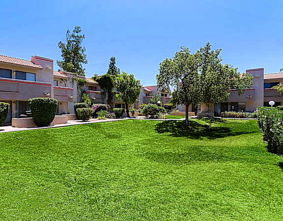 A grassy area in front of a building.